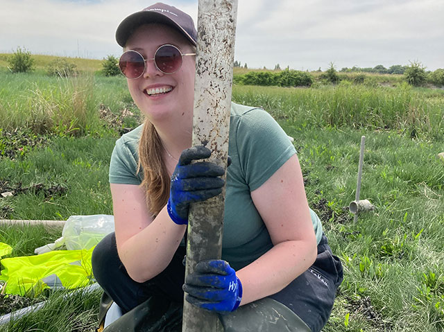 PhD student Megan Trusler recovering the first sediment core of the fieldtrip. 